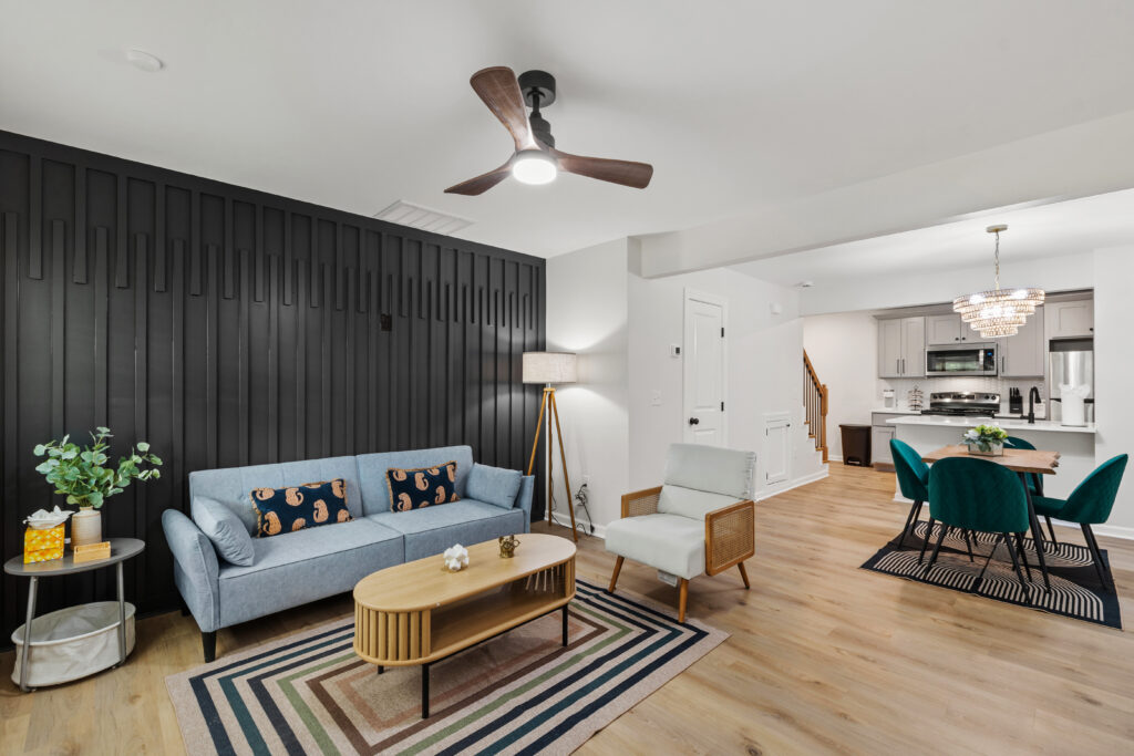 Open living and dining area with the kitchen beyond